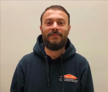 male employee in a SERVPRO hoodie